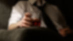 high-functioning man in professional attire drinking alone, reflecting on alcohol use