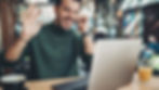 A middle-aged man speaking in a video call, offering recovery support from home.