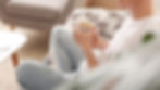 A person sitting quietly with a tea, reflecting during the first week of quitting alcohol.