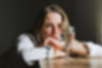 Person reflecting at home, recognising subtle signs of high-functioning alcoholism.