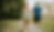 A man and woman jogging on a forest path, smiling and active—highlighting the benefits of exercise in addiction recovery.